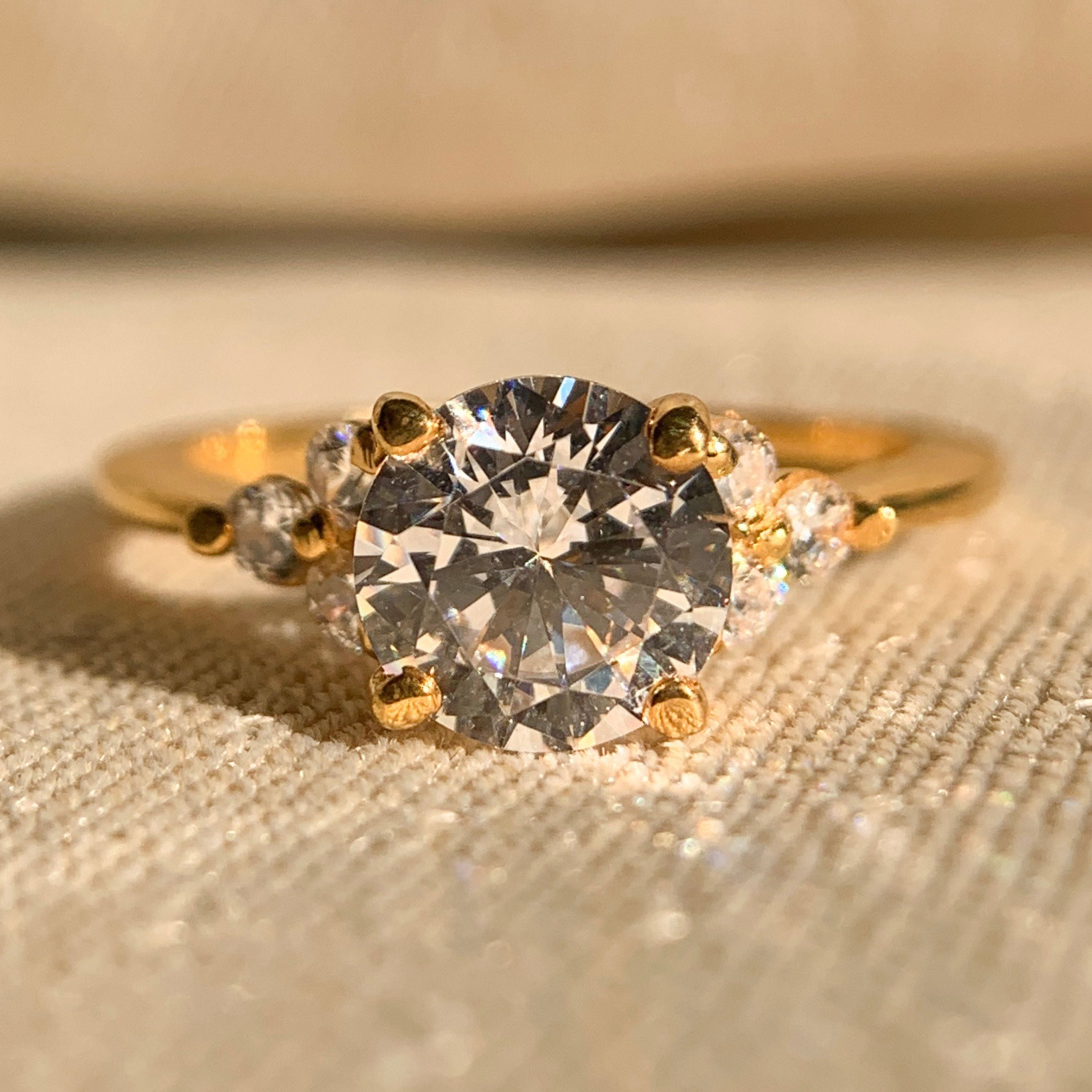 Classic round cut wedding ring with sparkling side stones